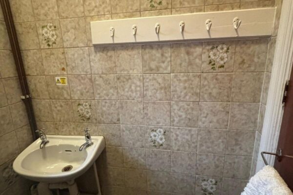 Exposed piping, old tiles